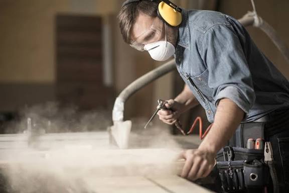 Dust coming off workspace man is working on