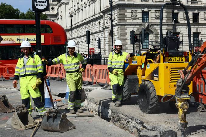Group of men working outside in the sun