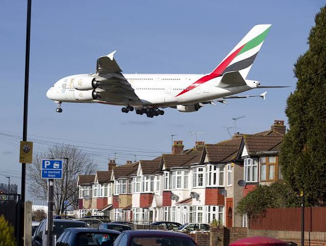 Plane flying over a neighbourhood