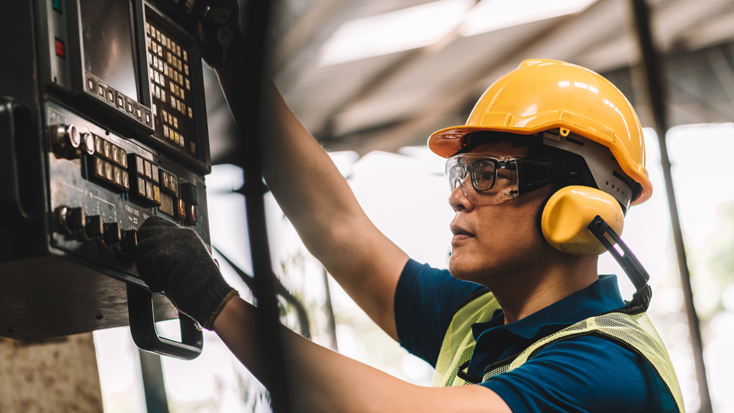 Man with protective earwear