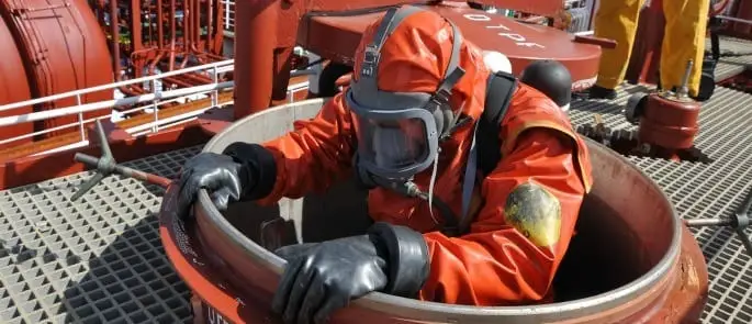 Man climbing into a manhole