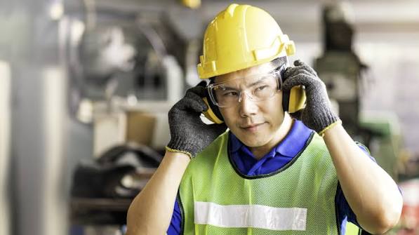 Worker with ear protection