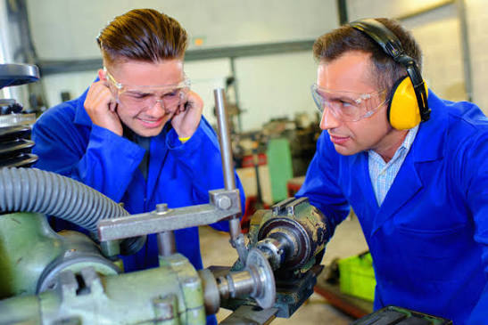 Two men wearing ear protection
