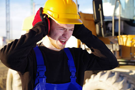 Man covering ears