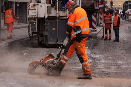 Men working in a noisy environment