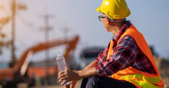 Man combating heat discomfort