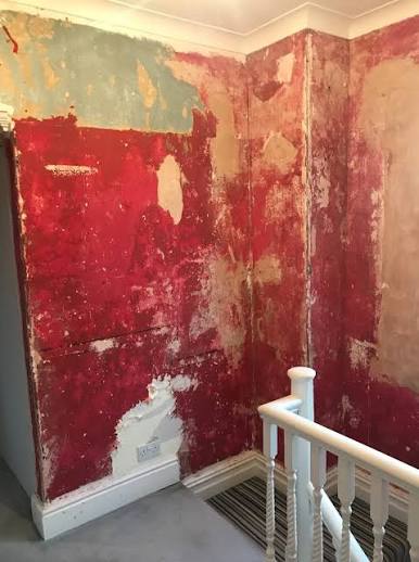 Room with exposed walls. Potential lead exposure