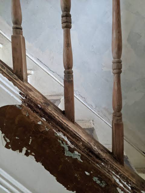 Exposed paint on the staircase