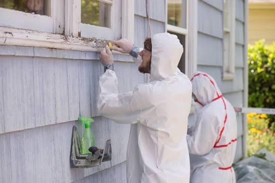 Workers removing lead safely